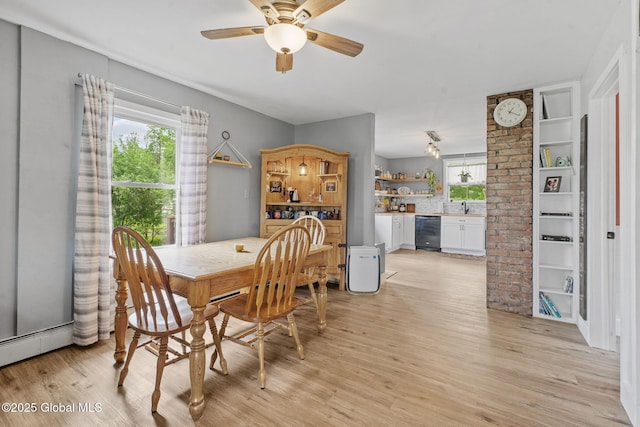 109 Wood Rd, Ballston Spa, NY 12020 - dining room with plenty of natural light, light wood-style flooring, a ceiling fan, and a baseboard heating unit