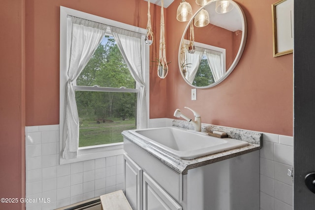 109 Wood Rd, Ballston Spa, NY 12020 - bathroom featuring tile walls, vanity, and wainscoting