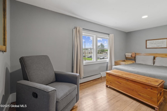 109 Wood Rd, Ballston Spa, NY 12020 - bedroom featuring a baseboard radiator, light wood-type flooring, and recessed lighting