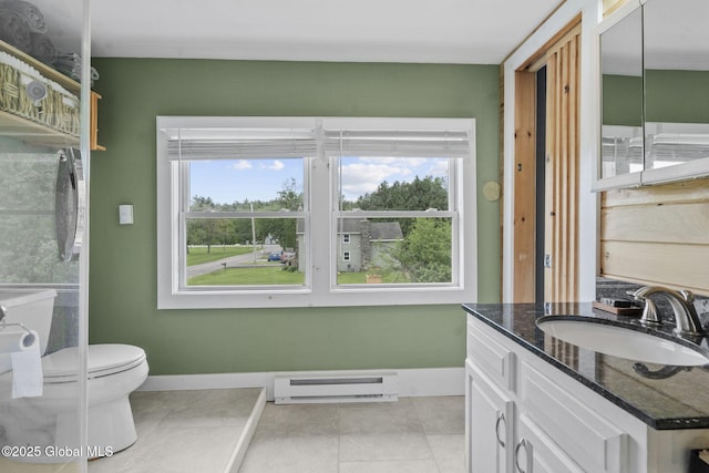 109 Wood Rd, Ballston Spa, NY 12020 - bathroom featuring a baseboard heating unit, healthy amount of natural light, vanity, and toilet
