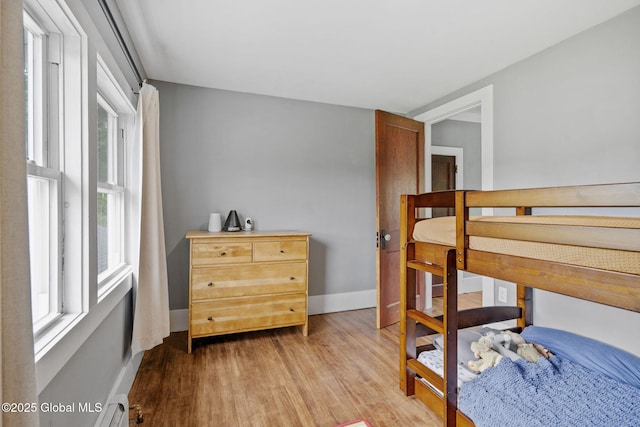 109 Wood Rd, Ballston Spa, NY 12020 - bedroom with wood finished floors, multiple windows, and baseboards