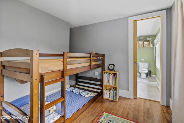 109 Wood Rd, Ballston Spa, NY 12020 - bedroom featuring wood finished floors, baseboards, and ensuite bath