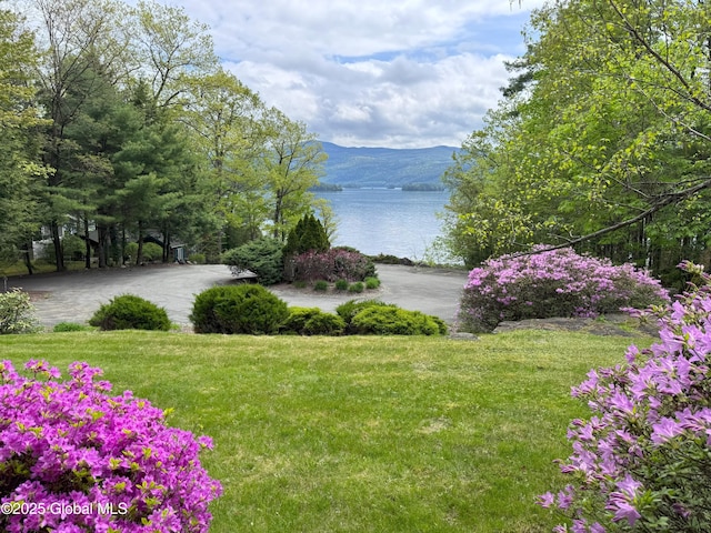 110 Juniper Hill Dr Unit 34, Bolton, NY 12814 - view of green lawn featuring a water and mountain view