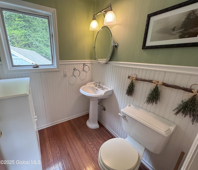 110 Juniper Hill Dr Unit 34, Bolton, NY 12814 - half bath with toilet, wood finished floors, and wainscoting