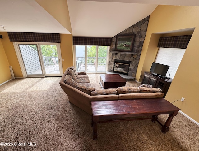 110 Juniper Hill Dr Unit 34, Bolton, NY 12814 - living room with carpet, a fireplace, lofted ceiling, and baseboards
