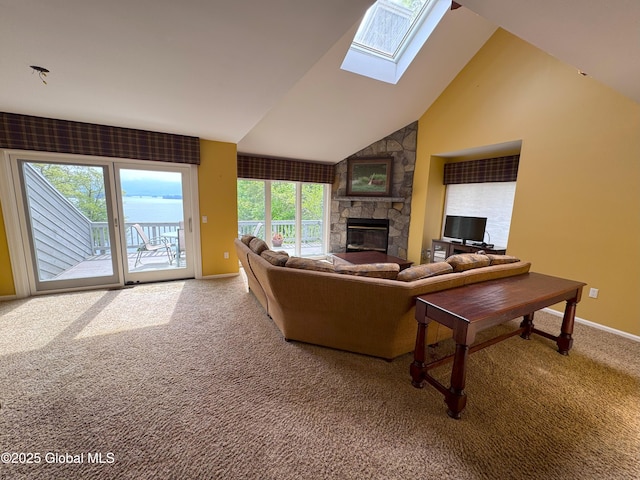 110 Juniper Hill Dr Unit 34, Bolton, NY 12814 - carpeted living area featuring a skylight, a fireplace, baseboards, and vaulted ceiling