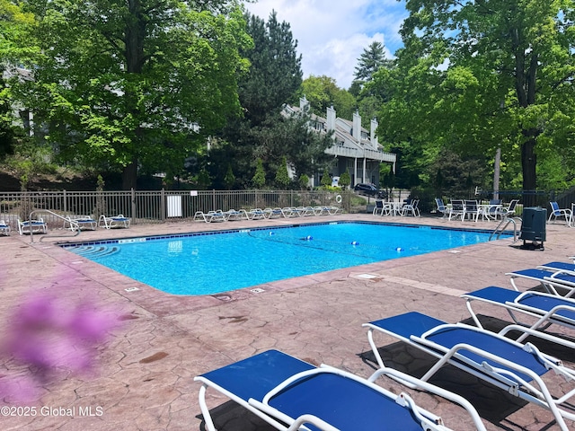 110 Juniper Hill Dr Unit 34, Bolton, NY 12814 - community pool with a patio and view of scattered trees