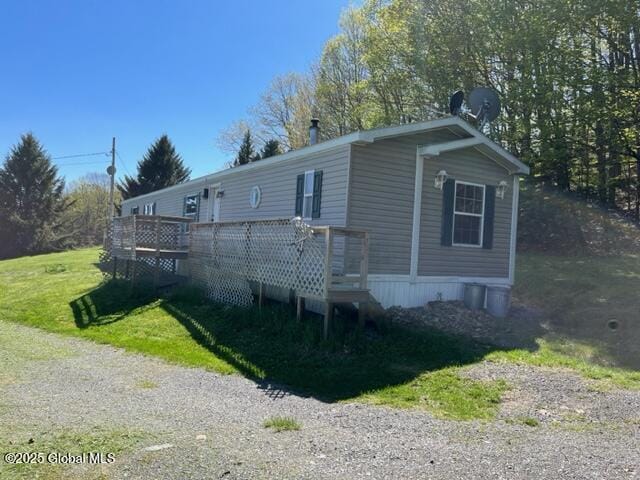 159 Eagle Mountain Rd, Summit, NY 12175 - manufactured / mobile home featuring a wooden deck and a front yard