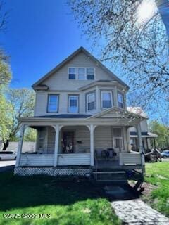 436 Lower Main St, Fort Edward, NY 12839 - victorian-style house with covered porch and a front lawn