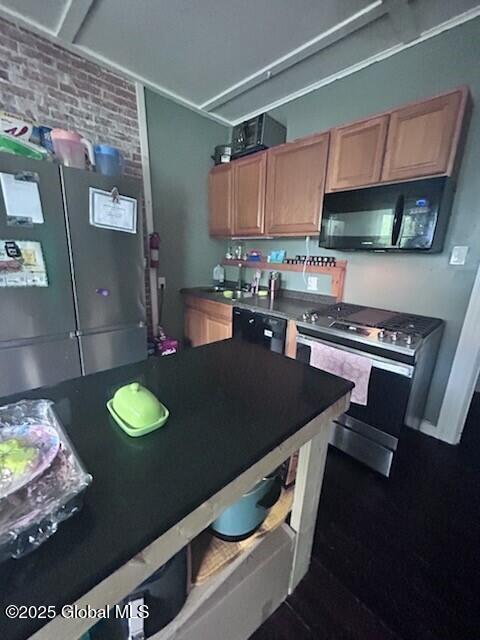436 Lower Main St, Fort Edward, NY 12839 - kitchen featuring black appliances, brick wall, dark countertops, and a sink