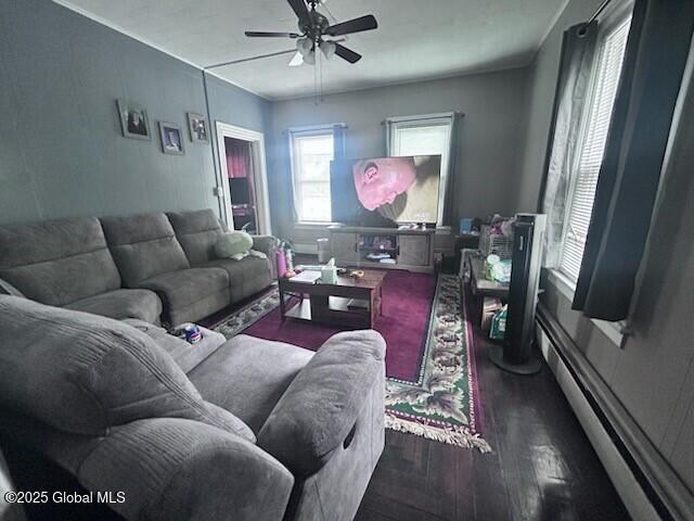 436 Lower Main St, Fort Edward, NY 12839 - living room with dark wood-style floors, ceiling fan, and a baseboard heating unit