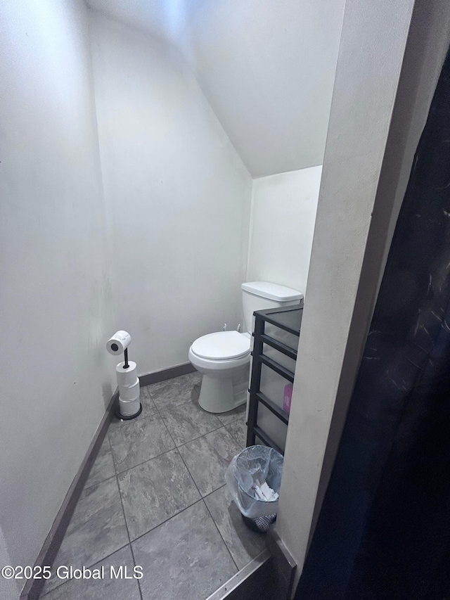 436 Lower Main St, Fort Edward, NY 12839 - bathroom with vaulted ceiling, toilet, and baseboards