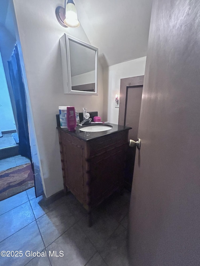 436 Lower Main St, Fort Edward, NY 12839 - bathroom featuring vaulted ceiling, vanity, and tile patterned flooring