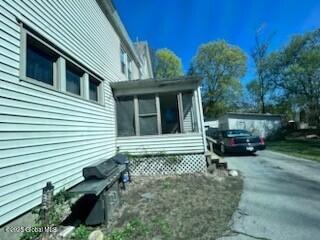 436 Lower Main St, Fort Edward, NY 12839 - view of home's exterior with a sunroom