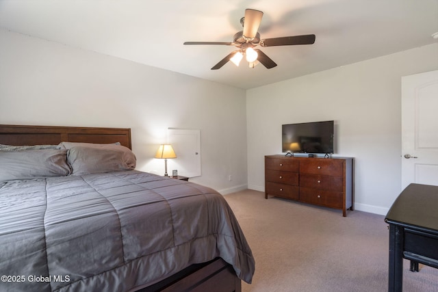 bedroom featuring carpet flooring, baseboards, and a ceiling fan