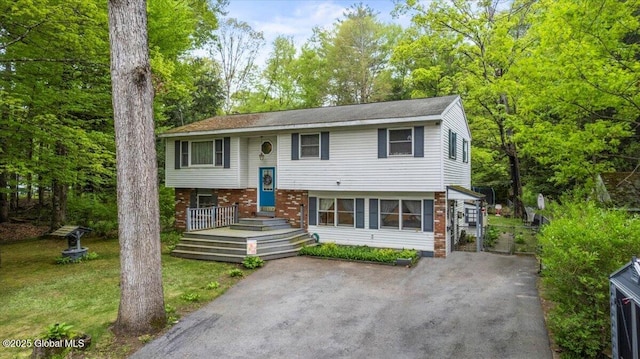 5131 Fairground Ave, Ballston Spa, NY 12020 - split foyer home with a front lawn and brick siding
