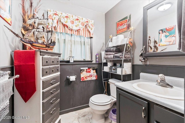 5131 Fairground Ave, Ballston Spa, NY 12020 - half bath featuring marble look tile flooring, vanity, and toilet