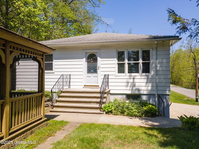 view of front of home with a shingled roof