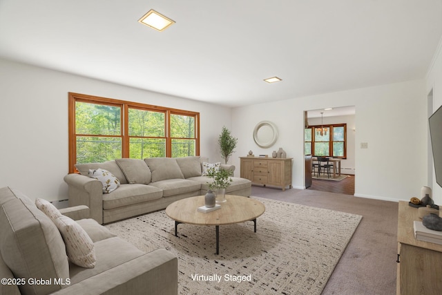 living room with light carpet and baseboards