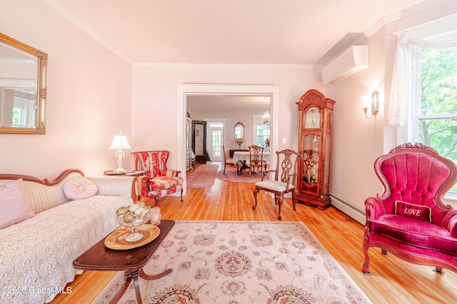living area featuring a wall mounted AC, plenty of natural light, wood finished floors, ornamental molding, and a baseboard heating unit