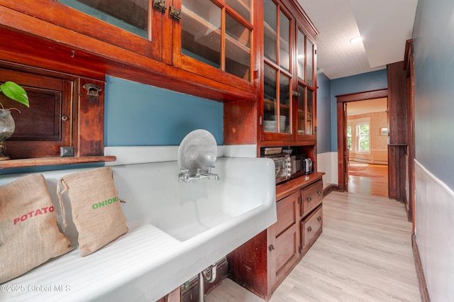 mudroom with light wood finished floors