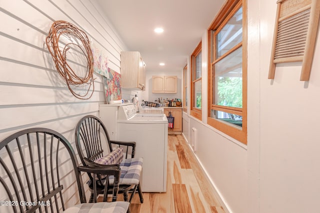 laundry area featuring light wood finished floors, recessed lighting, and washing machine and dryer