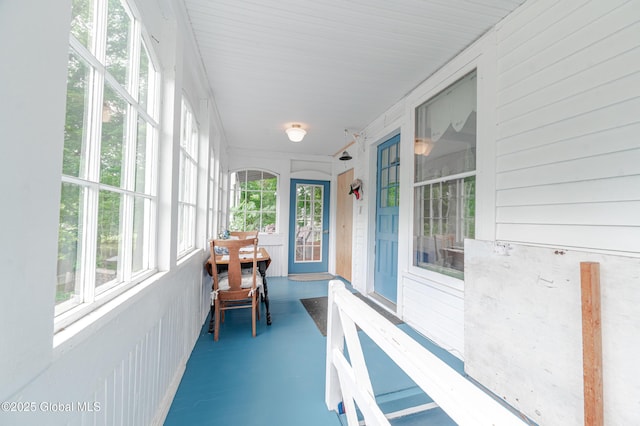 sunroom with finished concrete floors