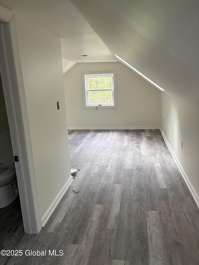 4632 State Highway 30, Broadalbin, NY 12010 - additional living space with dark wood finished floors, baseboards, and vaulted ceiling
