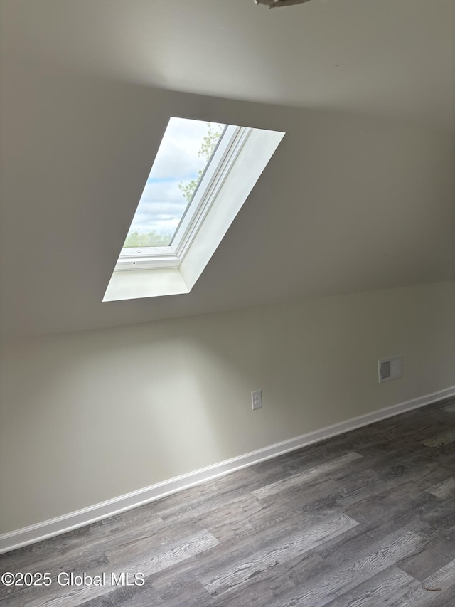 4632 State Highway 30, Broadalbin, NY 12010 - bonus room featuring a skylight, wood finished floors, vaulted ceiling, and baseboards