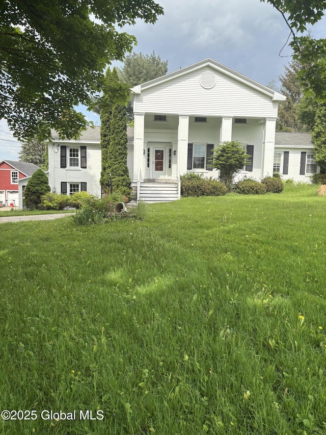 353 Truax Rd, Amsterdam, NY 12010 - neoclassical home with a front yard
