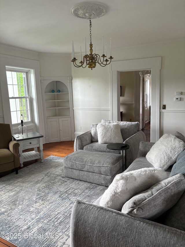 353 Truax Rd, Amsterdam, NY 12010 - living room with a chandelier, wood finished floors, and crown molding