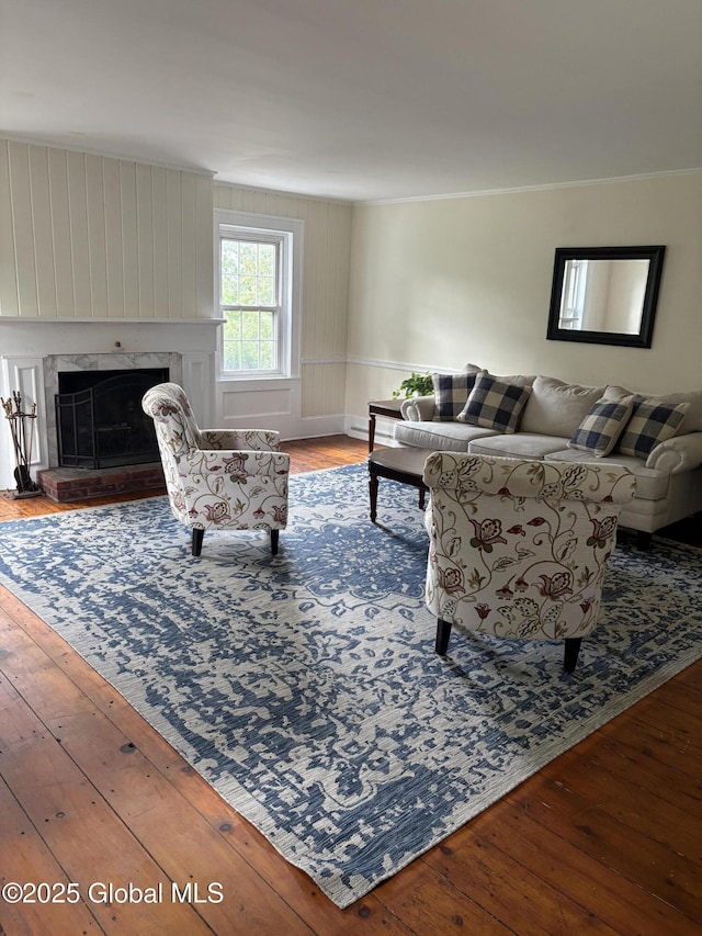 353 Truax Rd, Amsterdam, NY 12010 - living area featuring hardwood / wood-style floors, a high end fireplace, baseboards, and crown molding