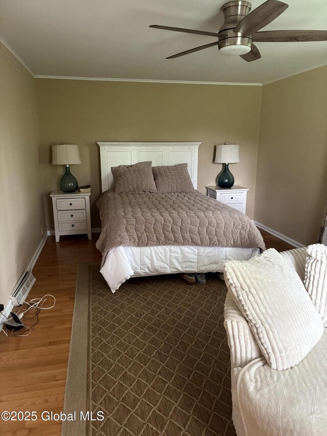 353 Truax Rd, Amsterdam, NY 12010 - bedroom with crown molding, dark wood-type flooring, baseboards, and a ceiling fan
