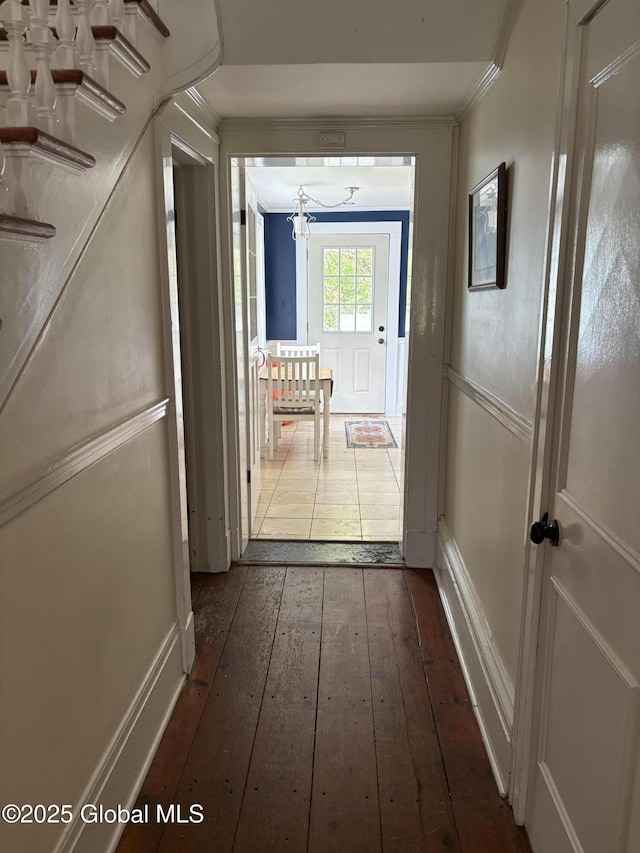 353 Truax Rd, Amsterdam, NY 12010 - hallway featuring dark wood-type flooring, a chandelier, and crown molding