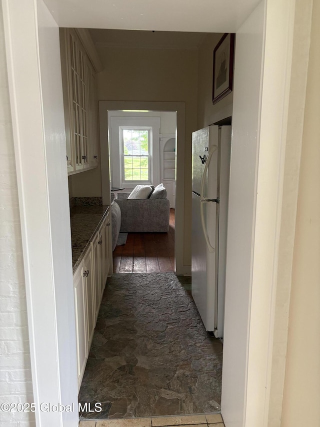 353 Truax Rd, Amsterdam, NY 12010 - kitchen featuring freestanding refrigerator and stone finish flooring
