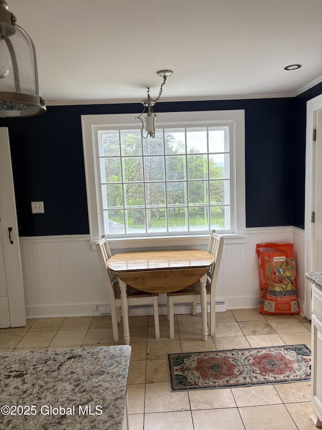 353 Truax Rd, Amsterdam, NY 12010 - dining room with wainscoting, light tile patterned flooring, a chandelier, and ornamental molding