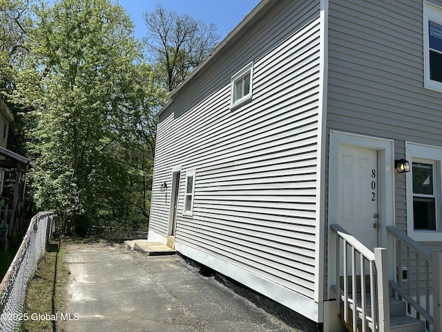 view of side of home with a patio