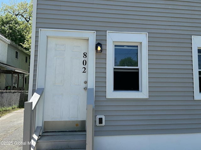 property entrance featuring fence