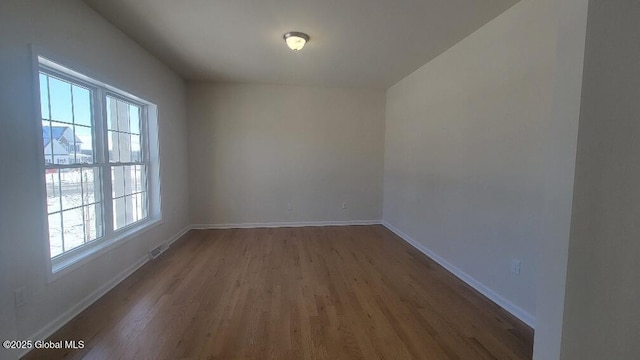 35 Sally St, Halfmoon, NY 12118 - unfurnished room featuring wood finished floors and baseboards
