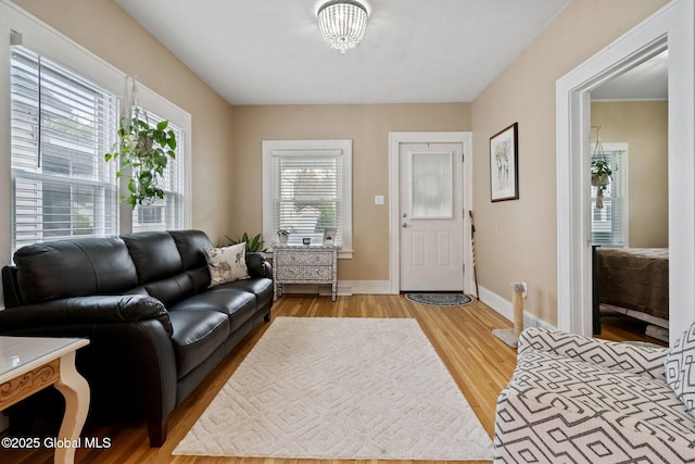 living room with wood finished floors and baseboards