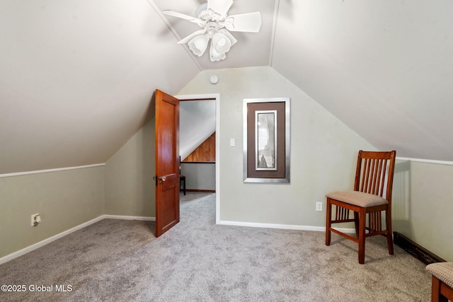 additional living space featuring carpet, a ceiling fan, vaulted ceiling, and baseboards