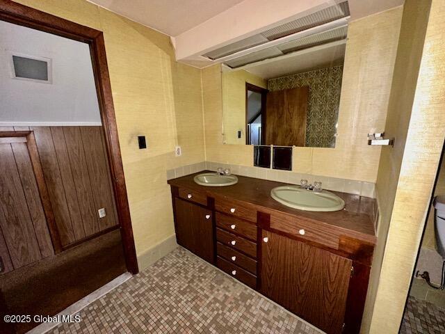 full bathroom with double vanity