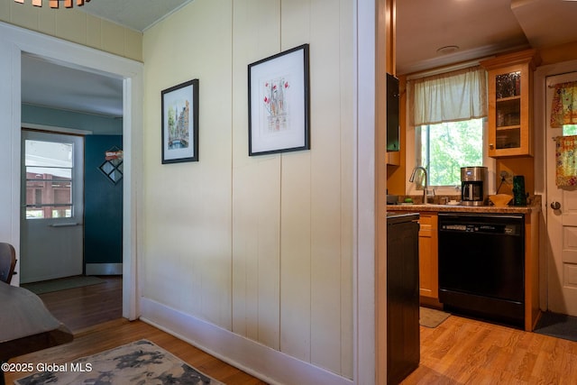 8 Pineridge Pl, Bethlehem, NY 12054 - kitchen with dishwasher, a sink, light wood-style flooring, glass insert cabinets, and baseboards