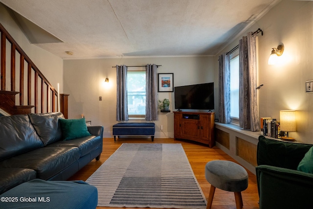 8 Pineridge Pl, Bethlehem, NY 12054 - living room featuring light wood-type flooring, stairs, crown molding, and baseboards