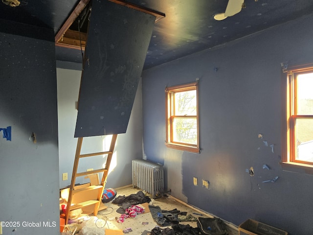89 Forbes St, Amsterdam, NY 12010 - bedroom featuring radiator and multiple windows
