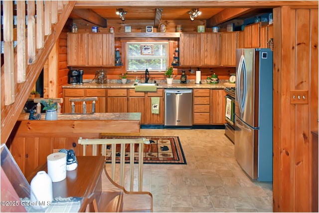152 Sweenie Fields Rd, Schroon Lake, NY 12870 - kitchen featuring appliances with stainless steel finishes, a sink, brown cabinets, and light countertops