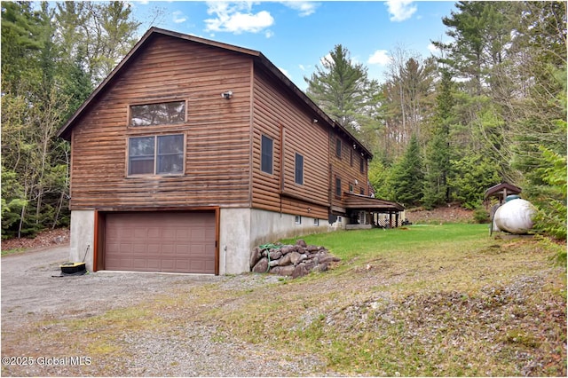 152 Sweenie Fields Rd, Schroon Lake, NY 12870 - view of side of property featuring an attached garage and driveway