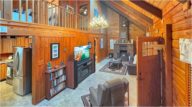 152 Sweenie Fields Rd, Schroon Lake, NY 12870 - living room with wood walls, a chandelier, beam ceiling, high vaulted ceiling, and a fireplace