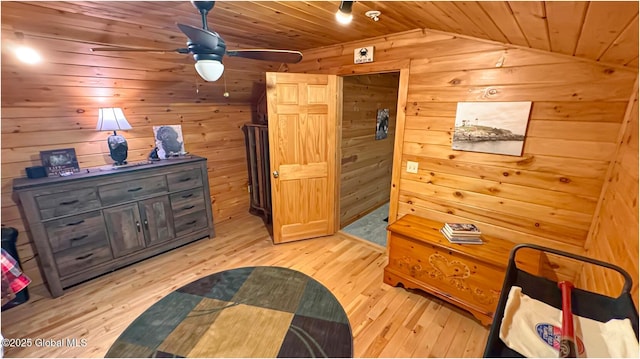 152 Sweenie Fields Rd, Schroon Lake, NY 12870 - bedroom featuring lofted ceiling, light wood finished floors, wood walls, and wood ceiling