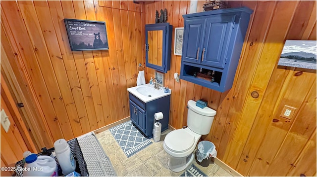152 Sweenie Fields Rd, Schroon Lake, NY 12870 - bathroom with wood walls, toilet, and vanity